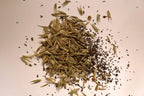 Small pile of native woodland seeds on a light background
